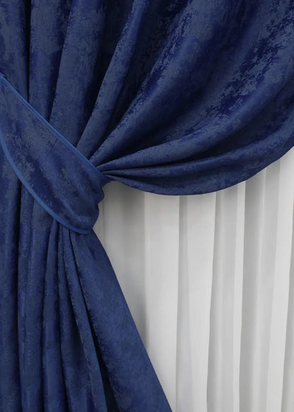 High-quality blue curtains crafted from premium jacquard fabric, providing an elegant and calming atmosphere.
