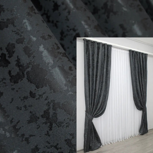 Elegant blue-graphite linen curtains with a subtle marble pattern, adding sophistication to modern interiors.
