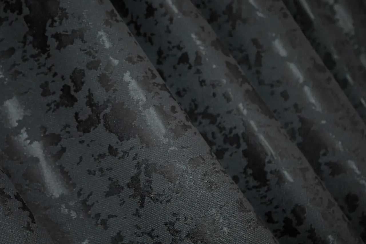 Contemporary blue-graphite marble-patterned linen curtains, designed for modern and industrial home styling.
