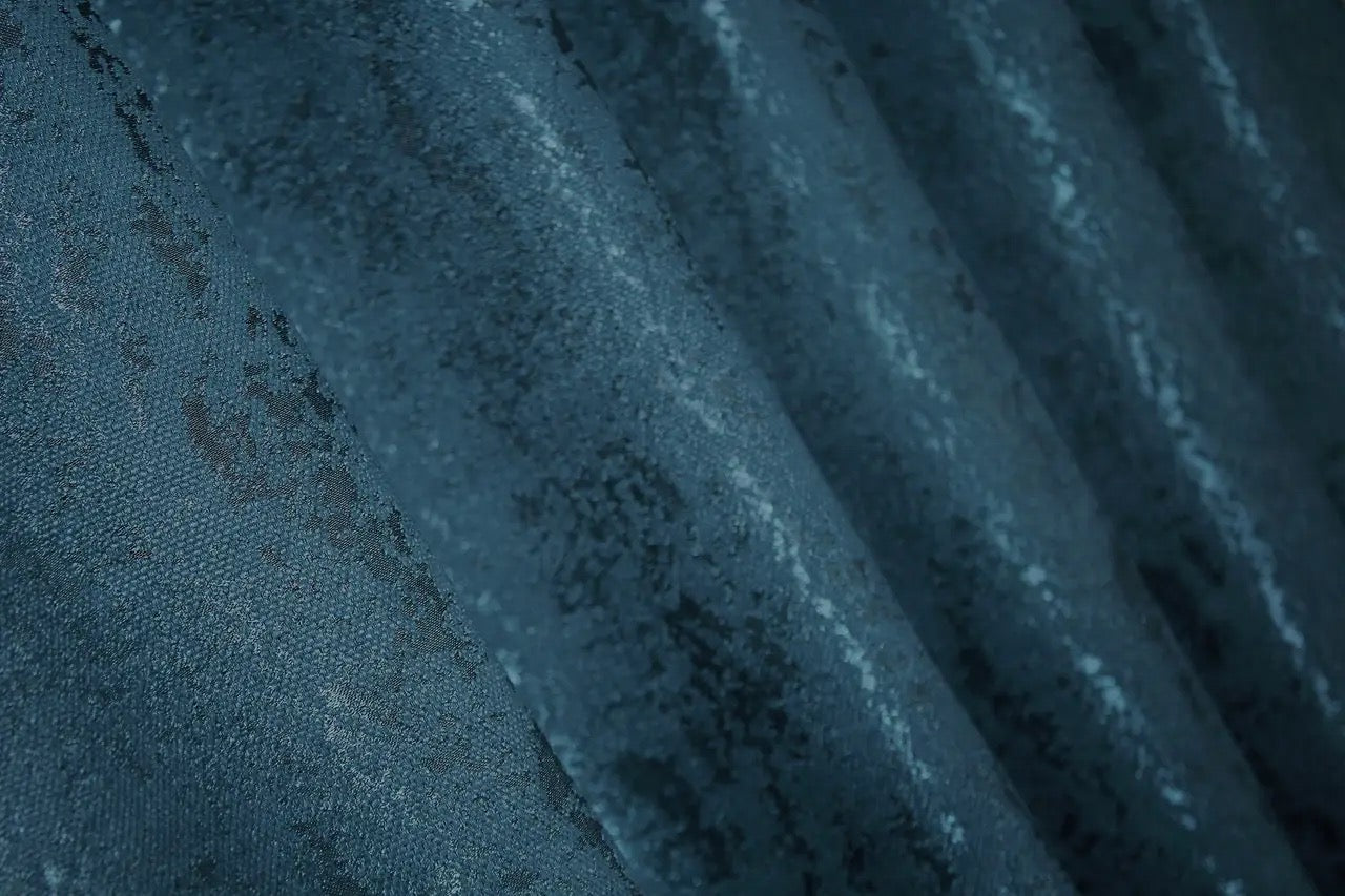 Luxury deep blue linen curtains with a subtle marble design, enhancing modern and classic interiors.
