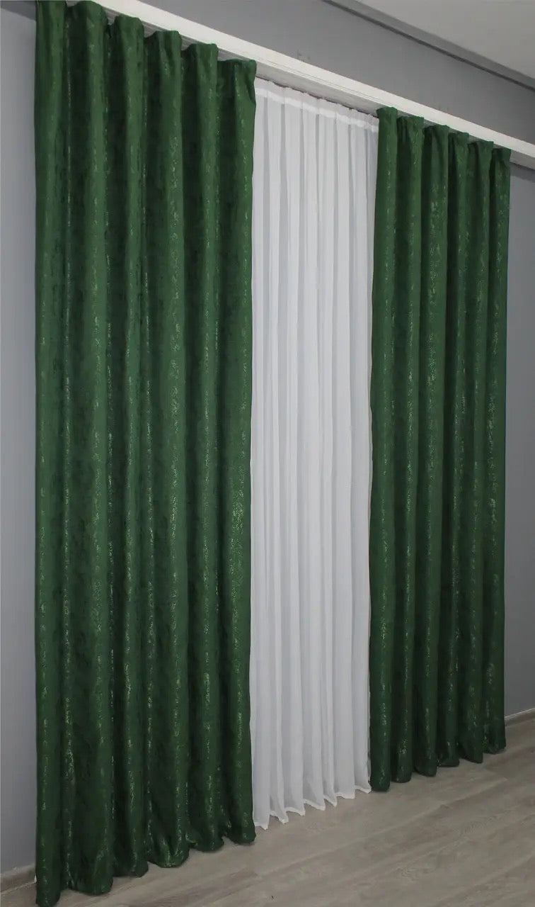 Modern emerald green linen curtains, designed to softly filter light while maintaining a serene atmosphere.

