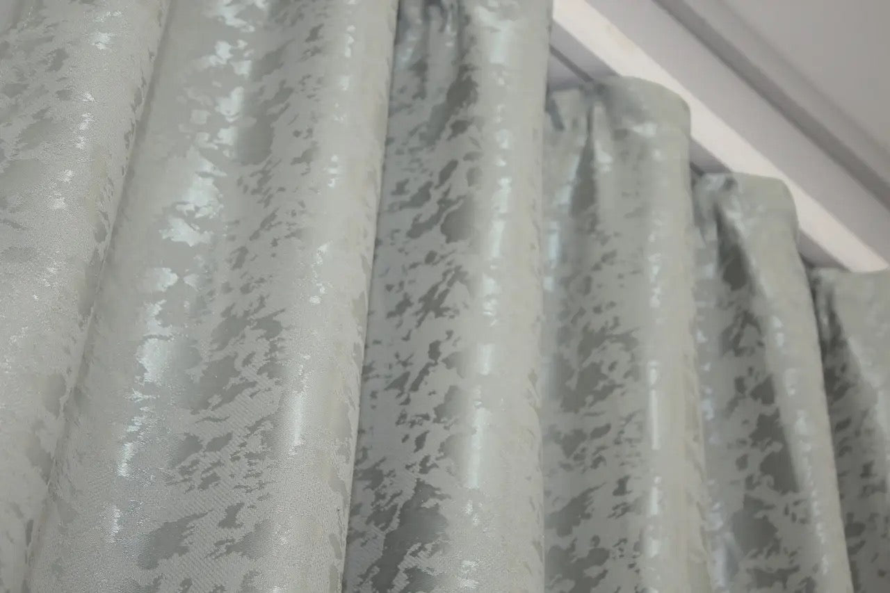 Contemporary light grey marble-patterned linen curtains, designed for modern and industrial home styling.
