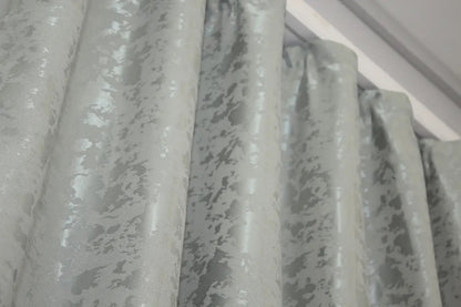 Contemporary light grey marble-patterned linen curtains, designed for modern and industrial home styling.
