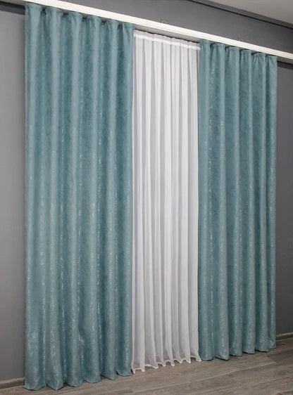 Modern sky blue linen curtains, designed to softly filter light while maintaining a tranquil atmosphere.
