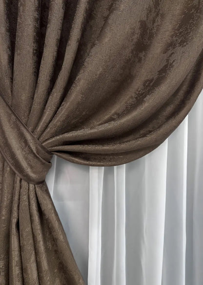 High-quality brown curtains made from premium jacquard fabric, complementing modern and traditional home interiors.
