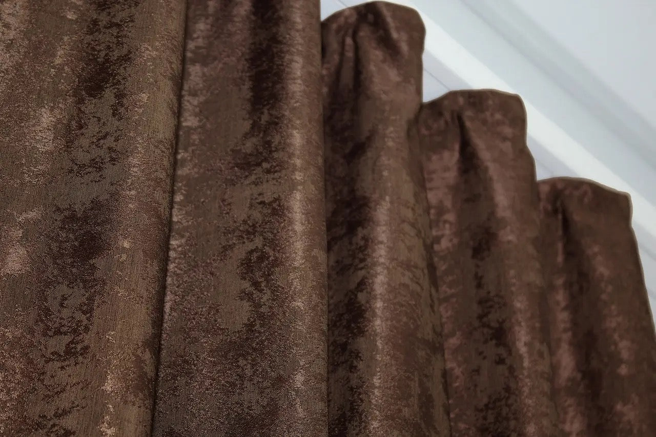 Warm chocolate brown curtains with a classic jacquard design, ideal for creating a cozy and inviting atmosphere.
