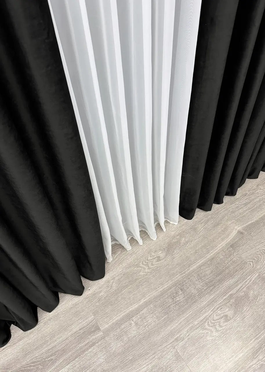 Carbon black luxury velvet curtains, perfect for enhancing a cozy and peaceful atmosphere.
