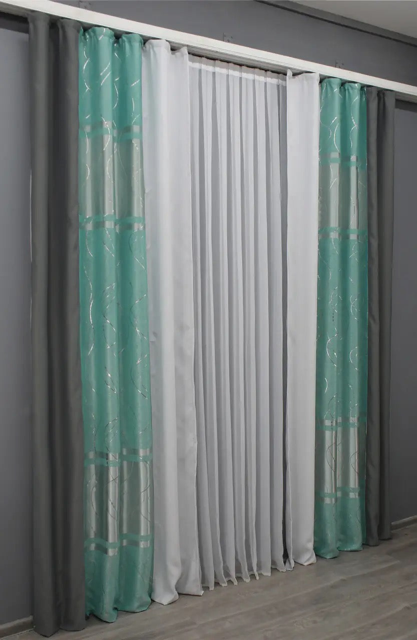 Chic graphite & turquoise-grey blackout curtains adding a luxurious touch to your interior with a bold two-tone look.
