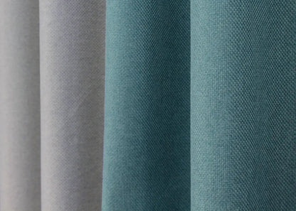 Timeless light grey and turquoise linen curtains, expertly crafted for effortless elegance, ideal for modern living rooms and office spaces.
