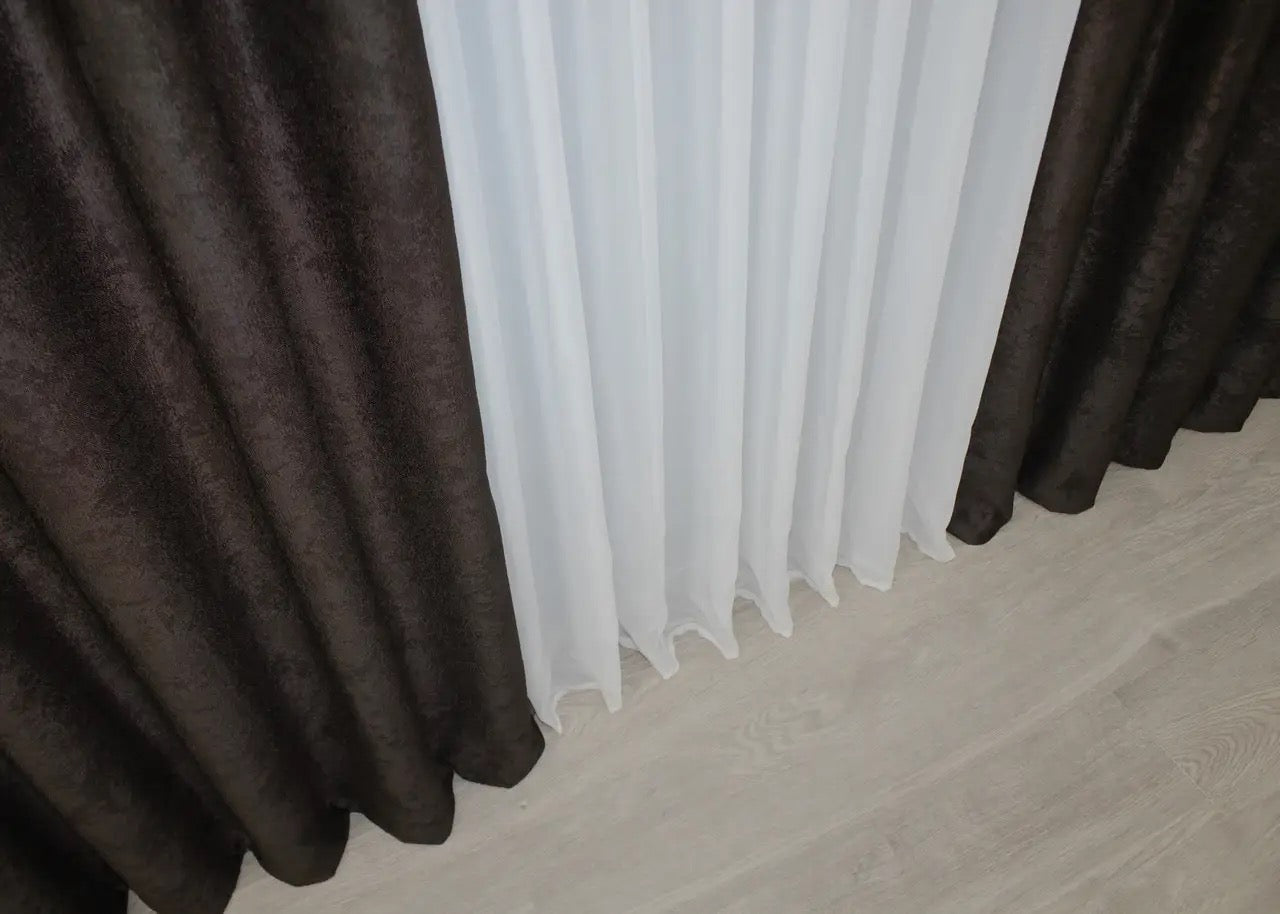 Chocolate brown linen-soft curtains with soft-touch fabric, reducing glare while complementing modern and vintage home designs.
