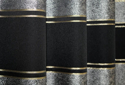 Classic black-grey curtains with a refined gold trim, creating a sleek and stylish atmosphere.
