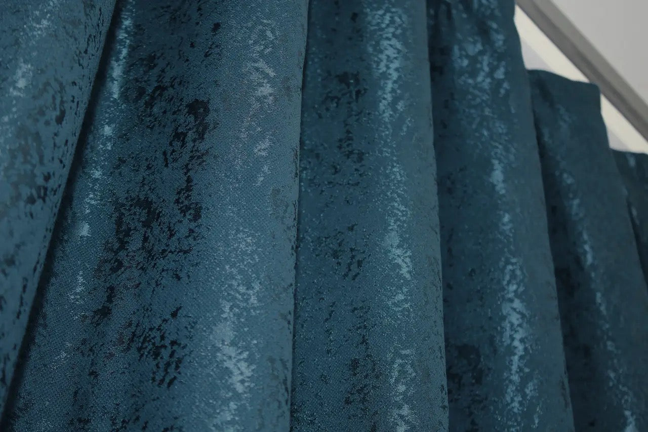 Stylish deep blue linen curtains with a natural texture, creating a cosy yet sophisticated atmosphere.
