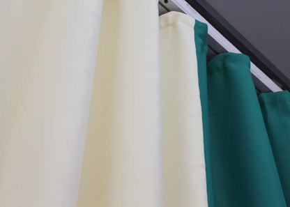 Stylish two-tone emerald green and cream blackout curtains that offer premium light-blocking performance and a refined design.
