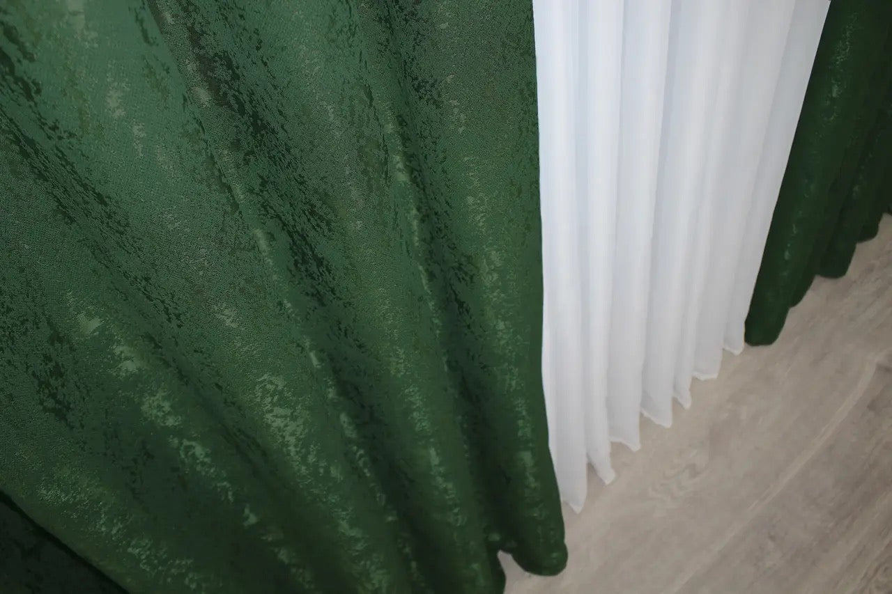 Ultra-soft emerald green linen curtains with natural light-filtering properties, perfect for bedrooms and lounges.
