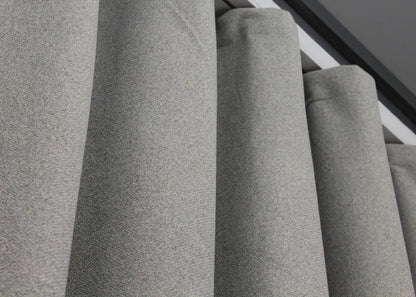 Thermal-insulated light grey linen blackout curtains, perfect for energy efficiency and a serene home environment.
