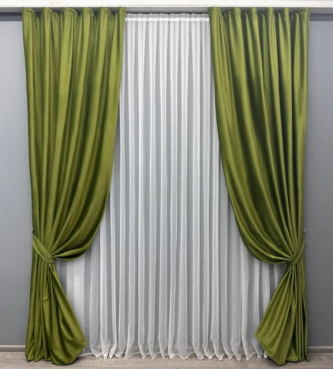 Classic olive green curtains styled in a modern bedroom interior.
