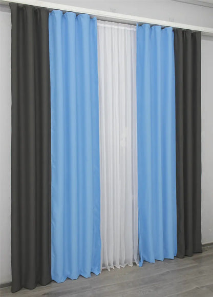 Turquoise and cocoa combined blackout curtains installed in a modern interior for an elegant and warm ambiance.
