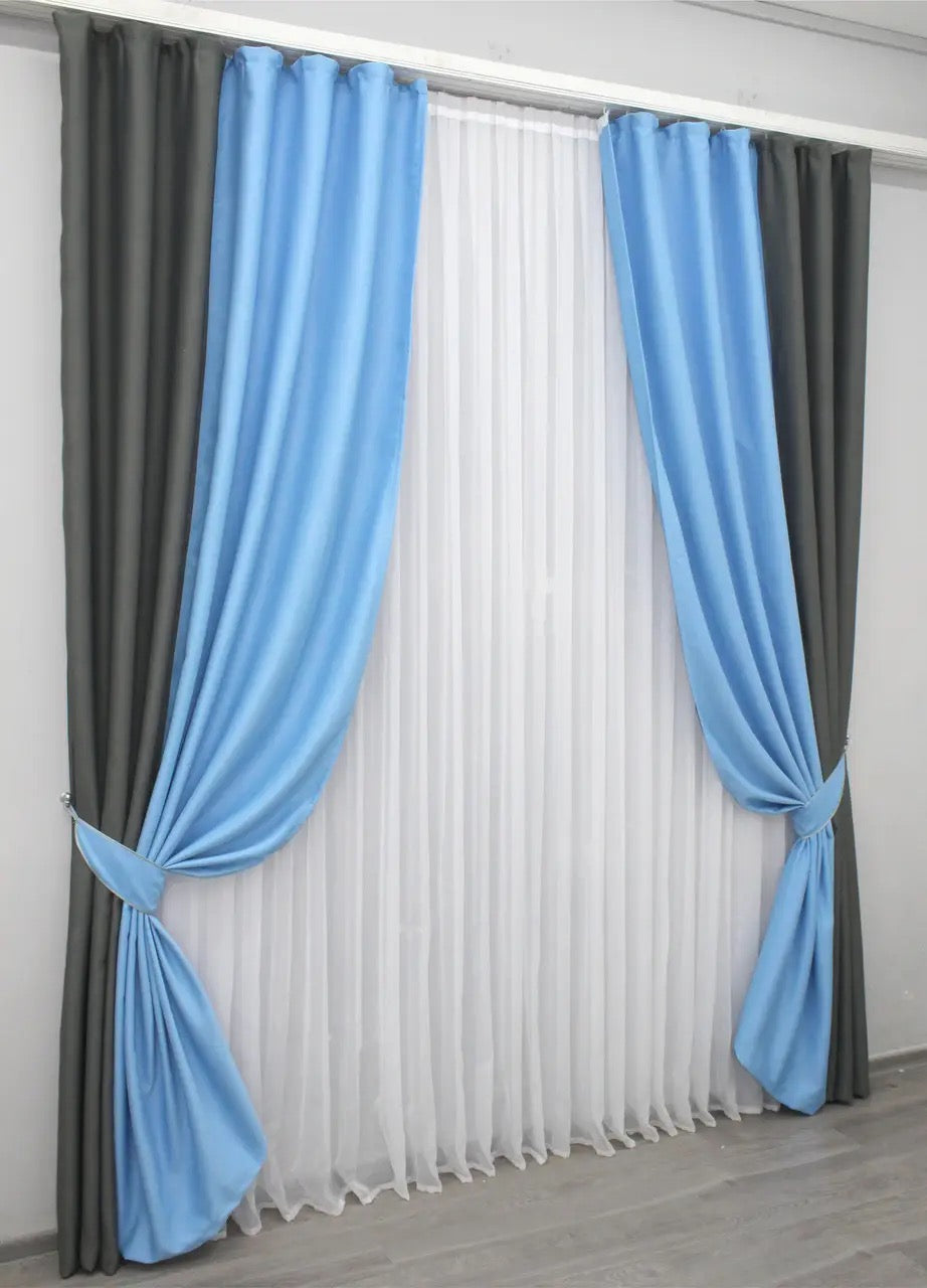 Luxurious two-tone turquoise and cocoa blackout curtains with smooth fabric texture.
