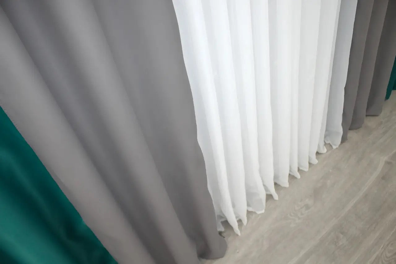 Refined two-tone combined blackout curtains in emerald and grey, perfect for modern and classic interiors.
