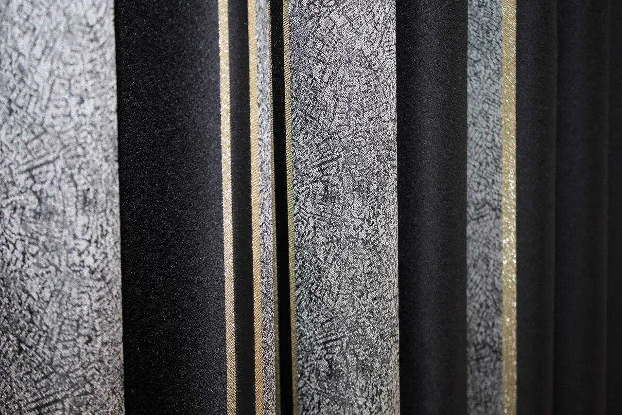 Contemporary black-grey and gold curtains with light-filtering fabric, enhancing any space.
