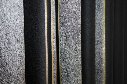 Contemporary black-grey and gold curtains with light-filtering fabric, enhancing any space.
