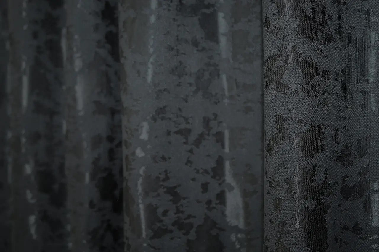 Classic and neutral blue-graphite linen curtains, offering privacy while allowing soft, diffused natural light.
