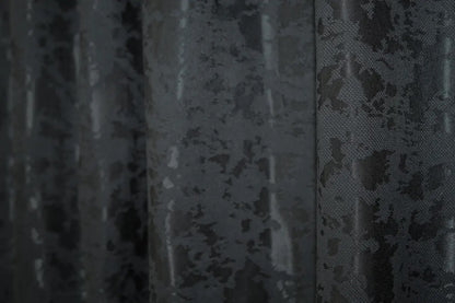 Classic and neutral blue-graphite linen curtains, offering privacy while allowing soft, diffused natural light.
