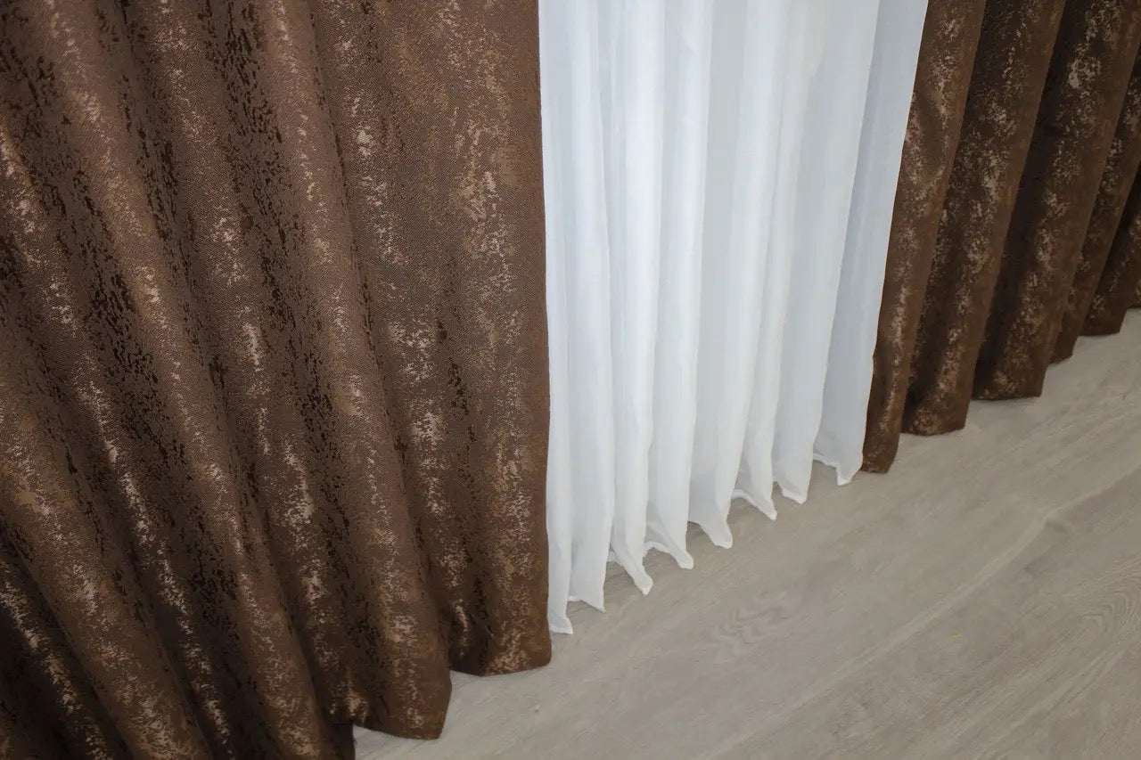 Contemporary brown linen drapes with light-filtering fabric, ensuring privacy and style.
