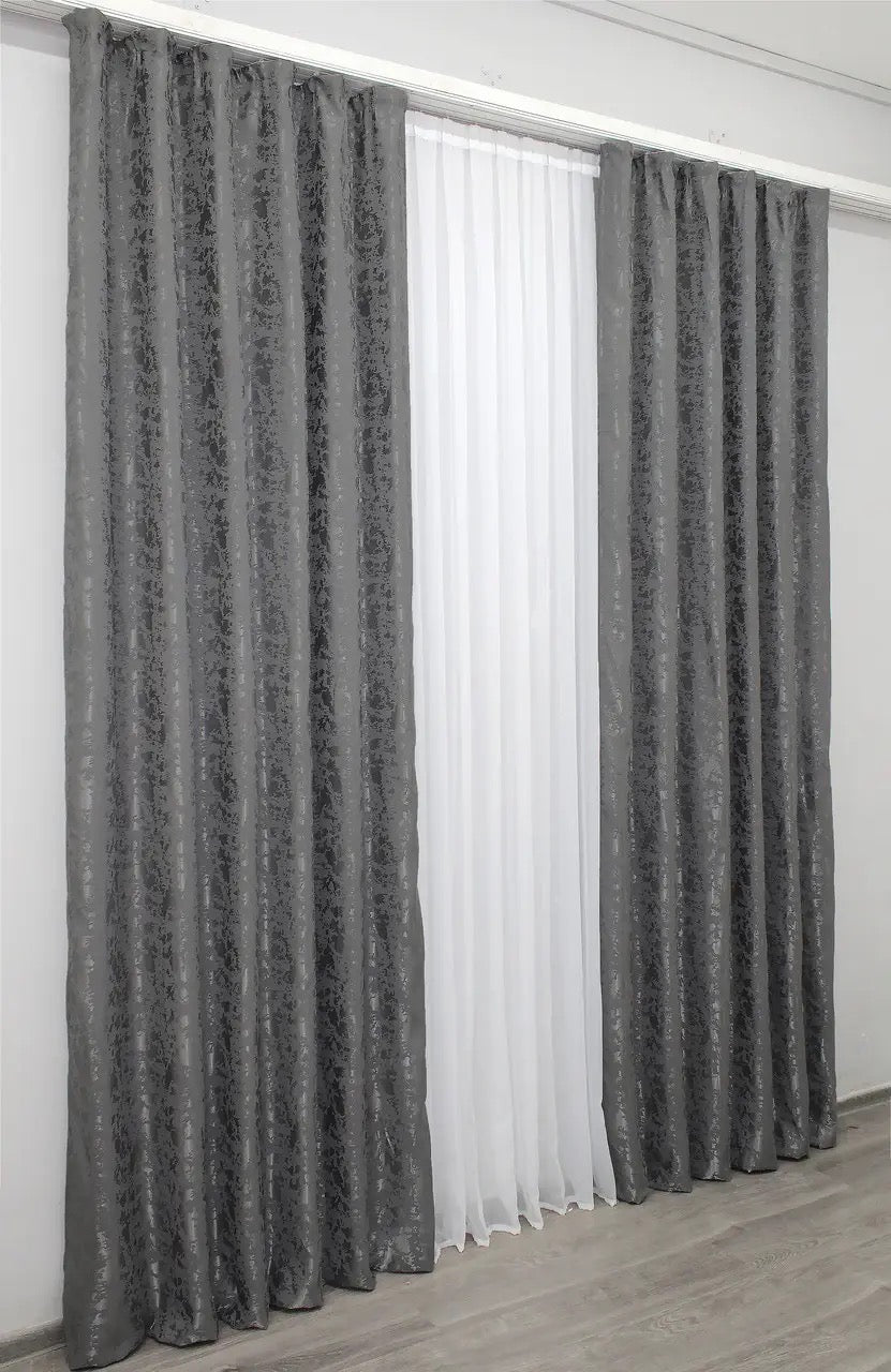 Classic and neutral grey linen curtains, offering privacy while allowing soft, diffused natural light.
