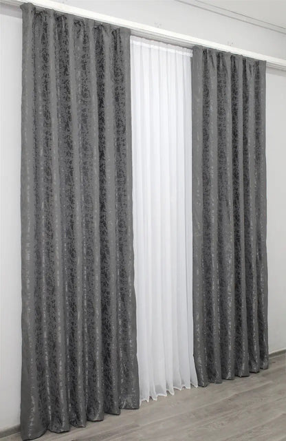 Classic and neutral grey linen curtains, offering privacy while allowing soft, diffused natural light.
