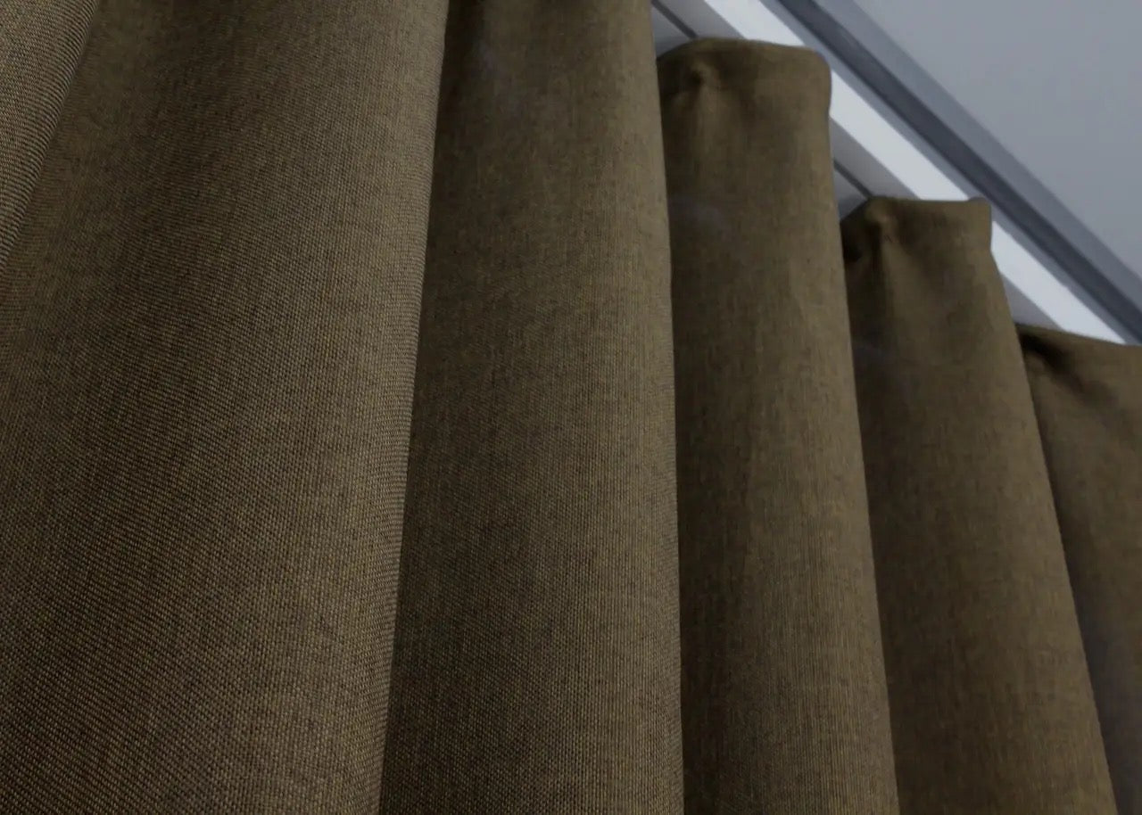 Farmhouse-inspired brown linen drapes, adding warmth and authenticity to living rooms and bedrooms.
