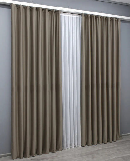 Dark beige velvet blackout drapes with a timeless, rich color, adding warmth and luxury to any home.
