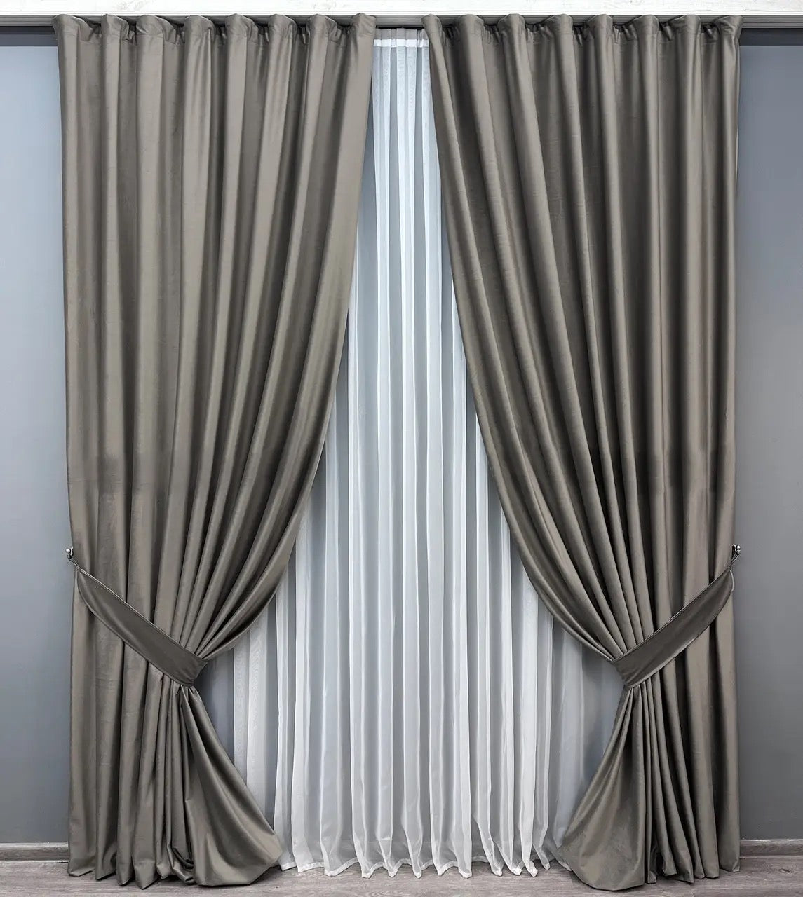 Dark graphite velvet room-darkening curtains with a plush, thick texture, offering a stylish and cozy ambiance for modern and classic interiors.
