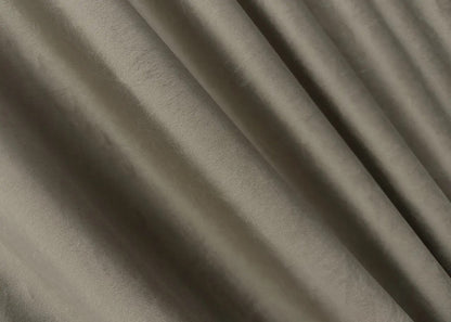 Dark greige velvet blackout drapes, designed for privacy and a sophisticated, modern atmosphere.
