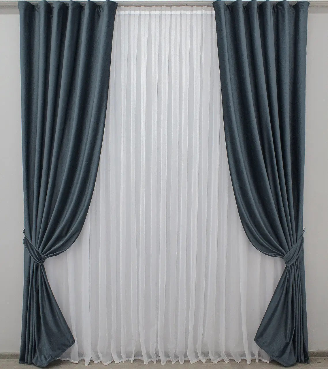 Elegant dark grey-blue velvet curtains with 90% light blocking, perfect for modern and classic interior decor, offering privacy and style.
