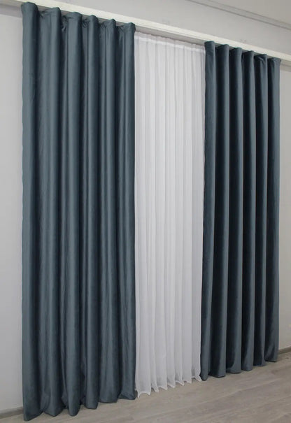 Dark grey-blue velvet blackout curtains for bedrooms and living rooms, providing a rich, sophisticated look while ensuring privacy and comfort.
