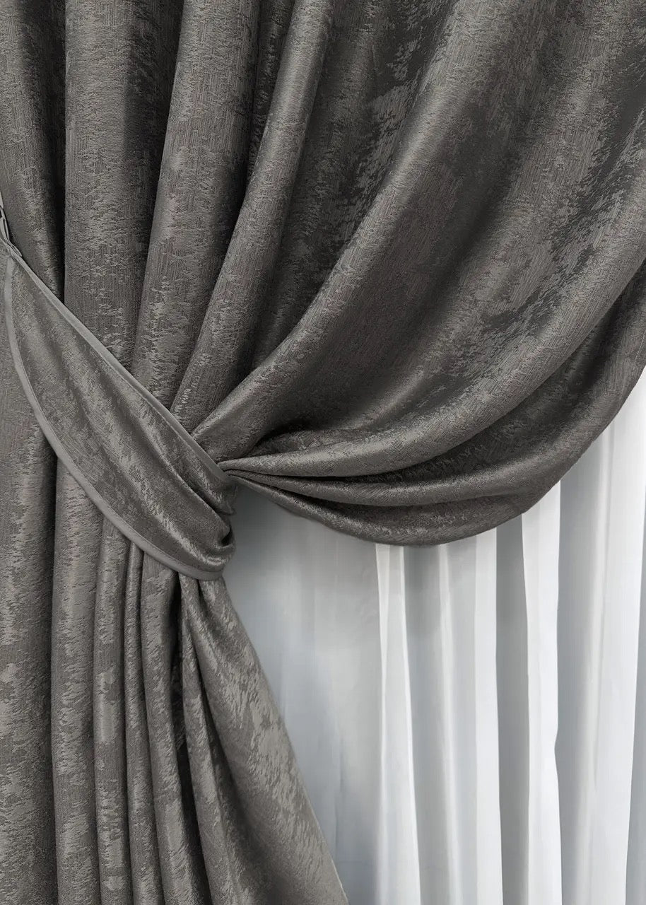 High-quality dark grey curtains made from premium jacquard fabric, complementing modern and traditional home interiors.
