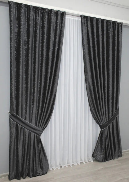 Dark grey blackout velvet curtains with a smooth, elegant texture, designed to complement modern and classic home décor.
