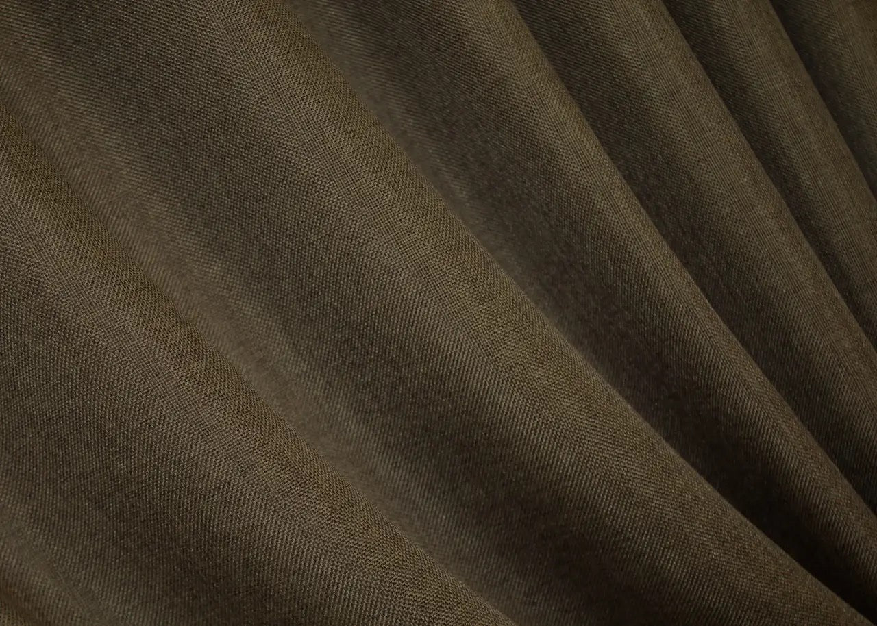 Muted brown linen curtains with a natural weave, providing a classic and stylish look for any room.
