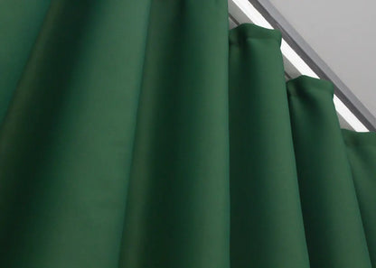Rich emerald green dimout blackout curtains with a premium jacquard weave.
