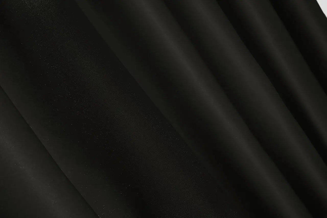Dark onyx blackout curtains with an elegant and smooth finish.
