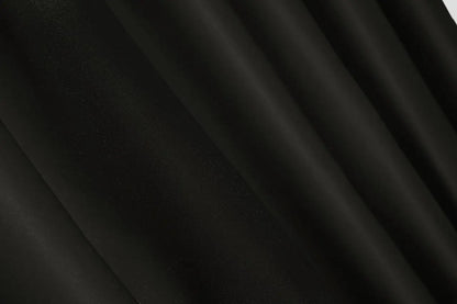 Dark onyx blackout curtains with an elegant and smooth finish.
