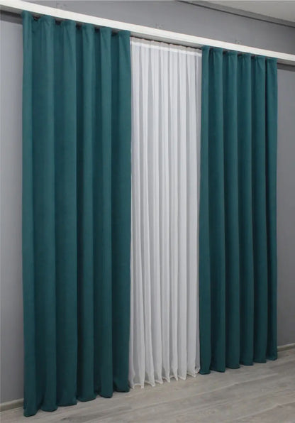 Rich azure microvelvet curtains with a flowing drape, perfect for enhancing any interior.
