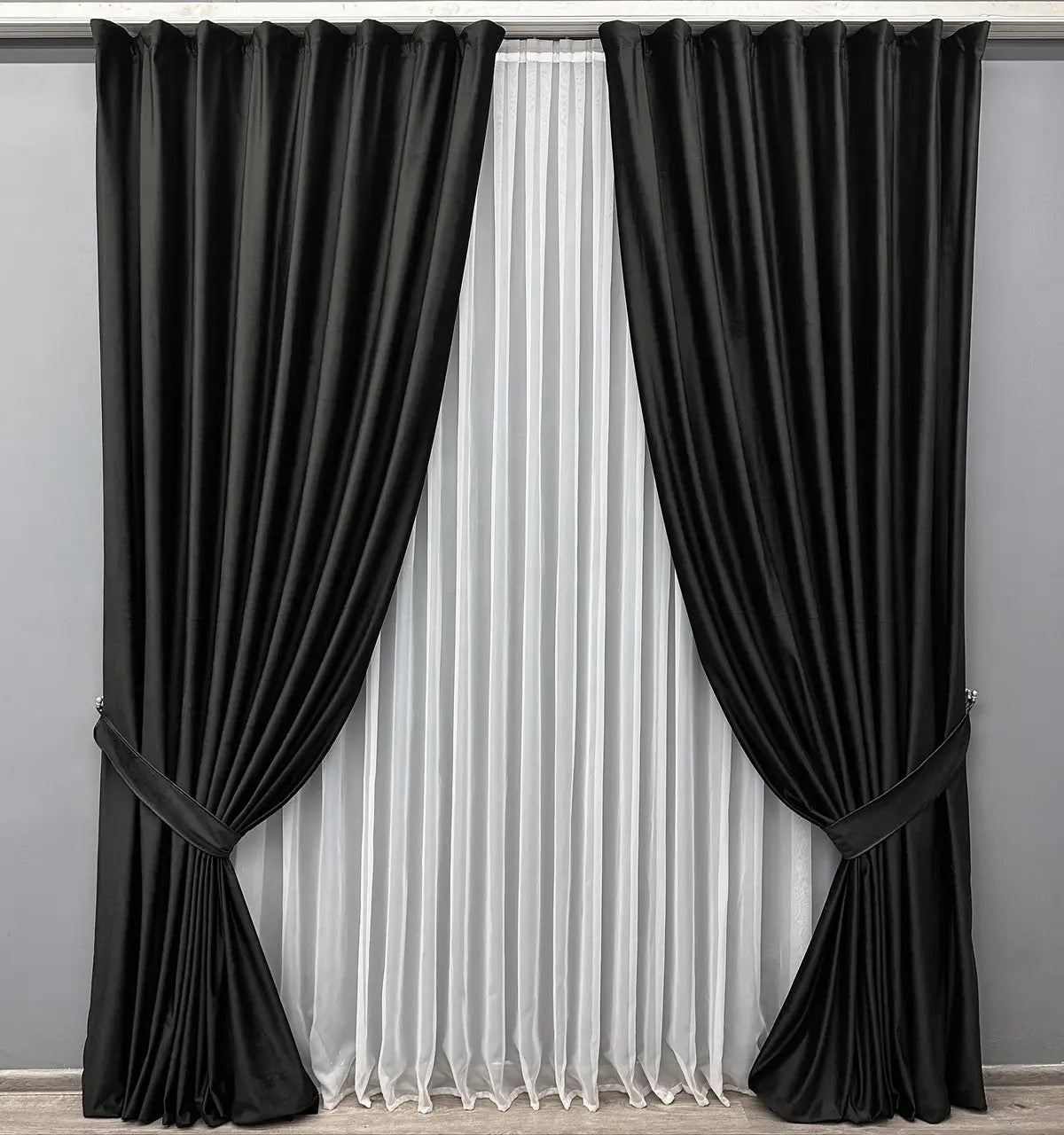 Deep charcoal velvet drapes with premium-quality fabric, ideal for modern and classic interiors.
