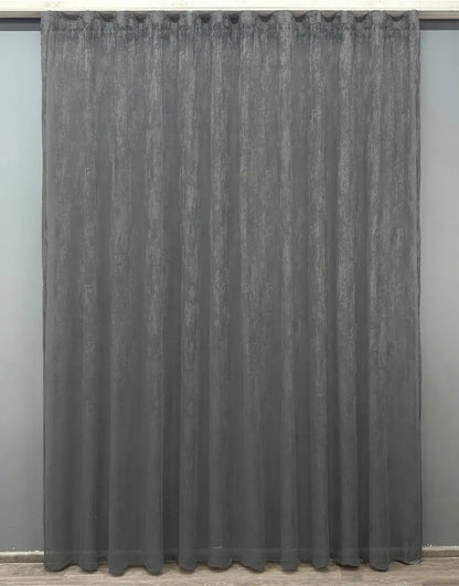 Deep grey curtain for soft light filtering in dark-themed interiors