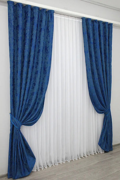 Stylish Ocean Blue jacquard curtains designed with 70% light-blocking fabric for privacy while allowing soft natural light.
