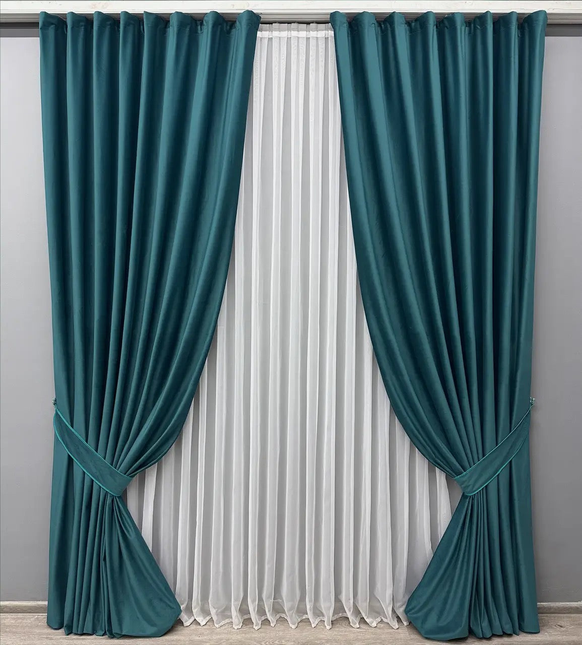 Deep teal velvet drapes with premium-quality fabric, ideal for modern and classic interiors.
