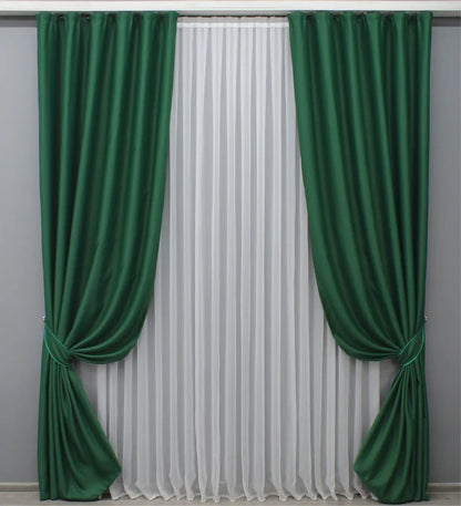 Deep forest green blackout curtains with a rich and elegant finish for stylish interiors.
