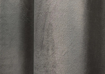 Earthy grey luxury velvet drapes with a thick, elegant texture, reducing light and noise for an ultimate cozy home ambiance.
