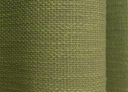 Modern light green linen curtains with a rustic woven texture, blending seamlessly with nature-inspired home decor.
